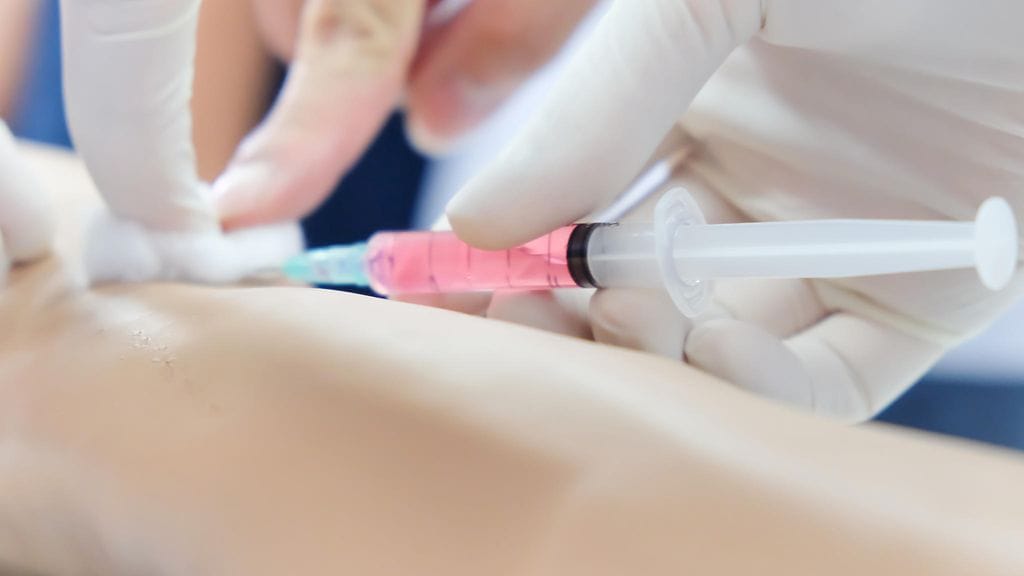 20 testissä mukana olleen miehen mukaan ruiskeen sivuvaikutukset olivat sietämättömiä. Kuvituskuva.