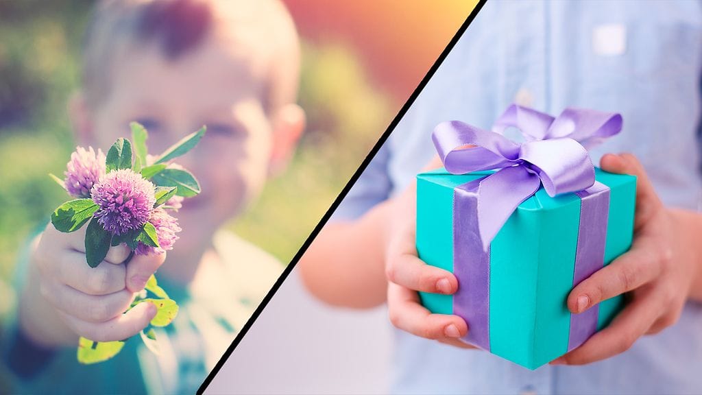 lapsi antaa kukkia ja lahjan